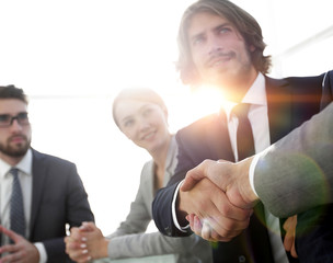 background image of handshake of business partners