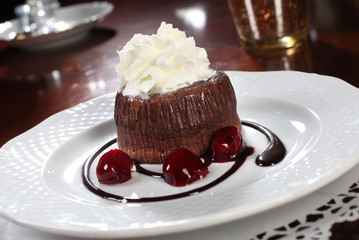chocolate cake with cherries and ice cream