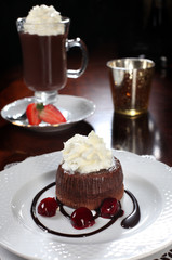 chocolate cake with cherries and ice cream