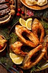 Christmas carp, Fried carp fish slices on a ceramic plate, close up. Traditional christmas eve dish. Polish Christmas