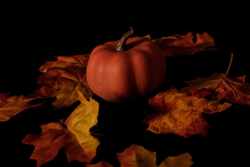 Thanksgiving and autumn leaves and punpkins with scare crow