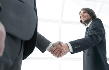 Businessmen making handshake - business etiquette, congratulatio