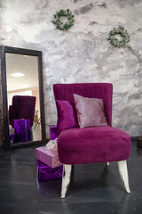 Purple armchair and christmas gifts, winter holiday concept