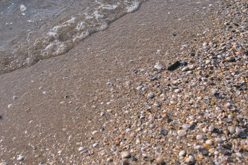 Shelly beach is a sea with small waves.
