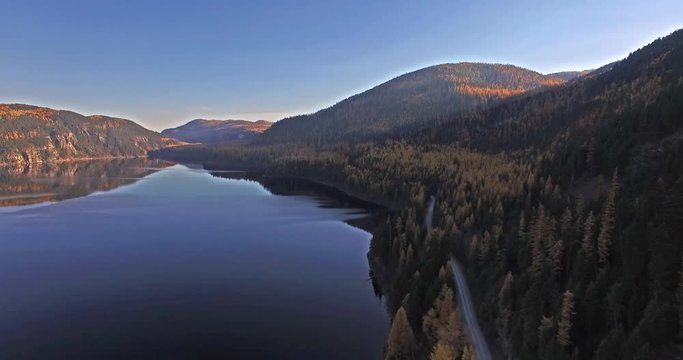 Aerial Drone Shot in Montana on a lake with a boat in the Fall or Autumn