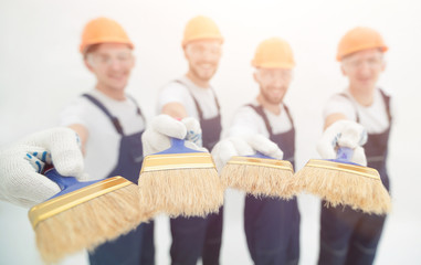 group of builders with different tools