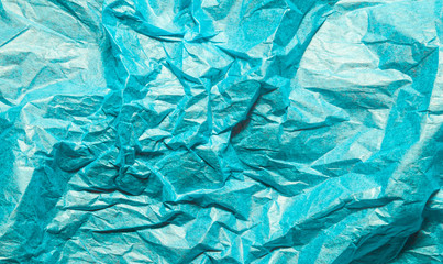 Blue crumpled paper abstract background