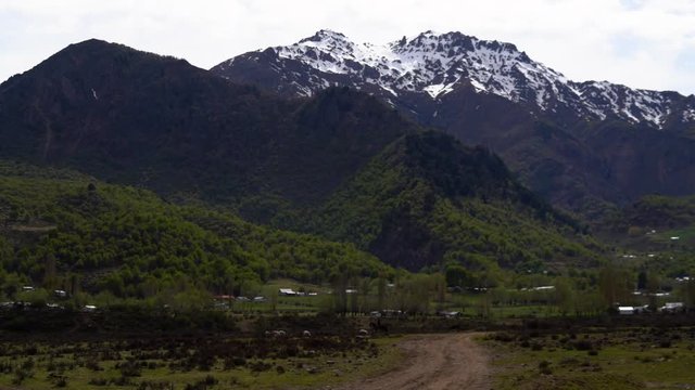 Beautiful landscape with mountains and a solitary horseman in the background on a cloudy day. Trapa Trapa region Alto Biobio Chile. Flat plane