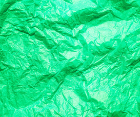 Fototapeta premium Green crumpled paper abstract background