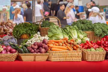 People gather on the weekends at the local outdoor farmers market.