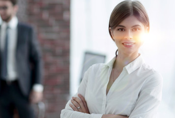 portrait of young business woman on the background of the office