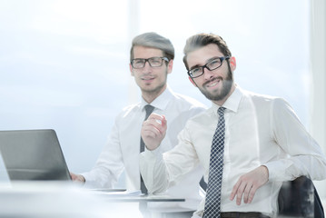 two business people sitting at the office Desk