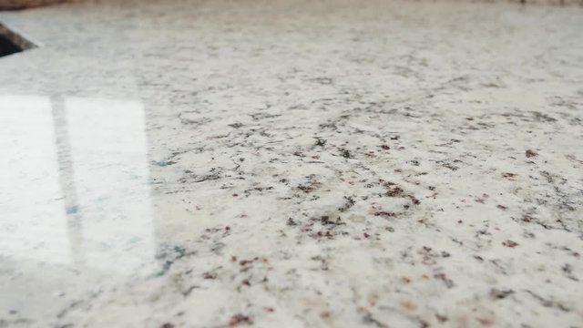 Close up dolly shot of beautiful granite counter top
