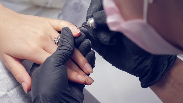 Correction of female nails with drilling machine