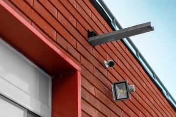 CCTV cameras on the wall. Monitor the security of a multi-story building or a private house....