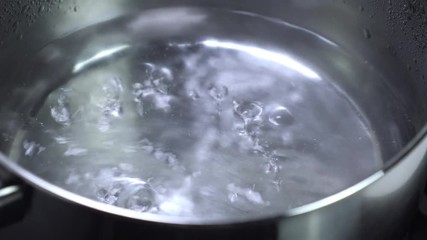 Boiling water in metal pan