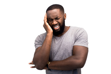 Severe pain in the head, migraine, flu symptoms, illness, virus, illness, cold. An adult male...