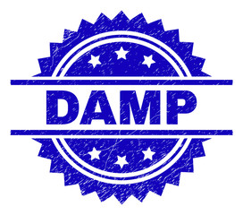 DAMP stamp seal watermark with distress style. Blue vector rubber print of DAMP title with dirty texture.