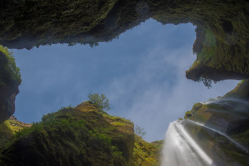 View from the base of a waterfall, looking skyward, Iceland