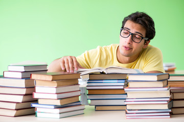 Student with too many books to read before exam