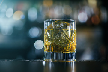 Old Fashioned whiskey coctail, server with oranges close up
