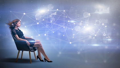 Elegant woman sitting in a sofa with network and connection concept
