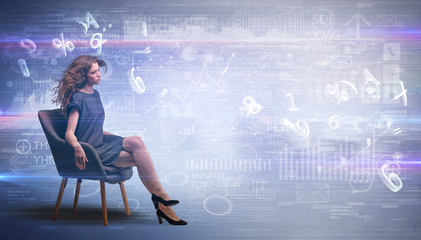 Elegant woman sitting in a sofa with numbers and reports concept
