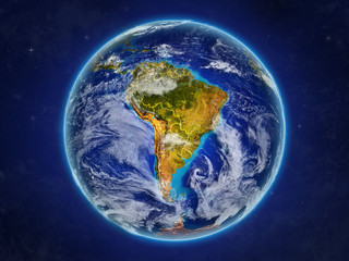 South America from space on realistic model of planet Earth with country borders and detailed planet surface and clouds.