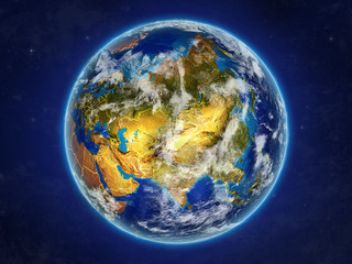 Asia from space on realistic model of planet Earth with country borders and detailed planet surface and clouds.