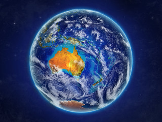 Australia from space on realistic model of planet Earth with country borders and detailed planet surface and clouds.