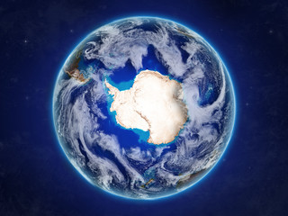 Antarctica from space on realistic model of planet Earth with country borders and detailed planet surface and clouds.