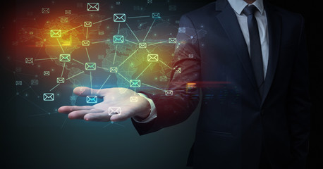Elegant businessman holding communication concept on his hand 