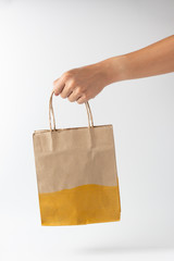 Man holding a brown paper bag