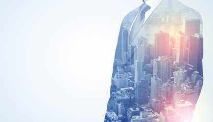 Businessman in suit standing thinking with metropolis graphic 