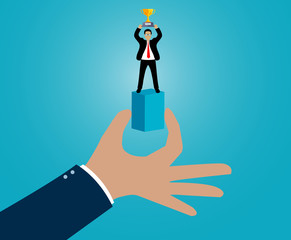 Hand holding a box there are Businessman standing holding a trophy. leadership. advantage. Business Success concept. cartoon vector Illustration