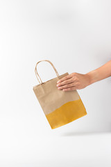 Man holding a brown paper bag