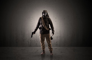 Bad agent in a dark room with arms on his hand and gas mask
