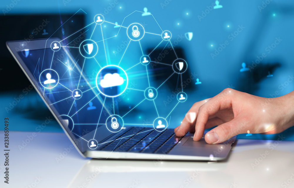 Fototapete hand using laptop with centralized cloud computing system and network security concept