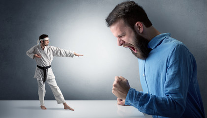 Giant hipster man yelling at a small karate man