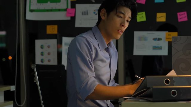 Businessman hard working to late night and work overtime at office. Manager assigns task after timeout of work. Concept of business management, assignment job late and working overtime.