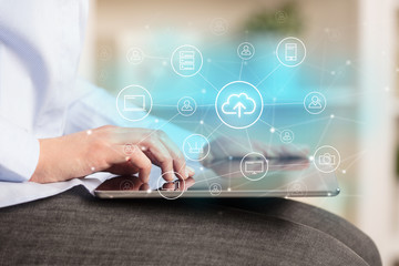 Business woman using tablet with network security and online storage system concept
