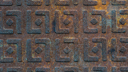 Steel sheet with pattern notches - gray vintage metal abstract dark background, texture close-up