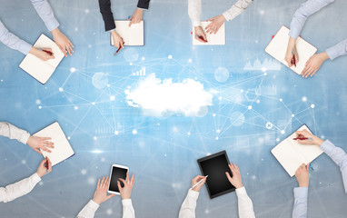 Group of people with devices in hands working on reports with online teamwork and cloud technology...