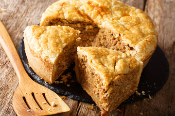 Tourtiуre  French-Canadian Meat Pie stuffed with meat and potatoes close-up. Horizontal