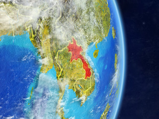 Laos on planet planet Earth with country borders. Extremely detailed planet surface and clouds.