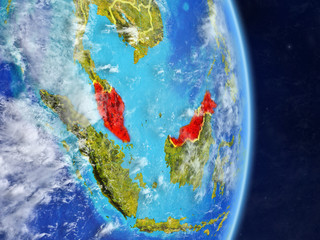 Malaysia on planet planet Earth with country borders. Extremely detailed planet surface and clouds.