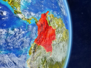 Colombia on planet planet Earth with country borders. Extremely detailed planet surface and clouds.