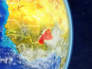 Burkina Faso on planet planet Earth with country borders. Extremely detailed planet surface and clouds.