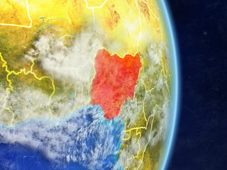 Nigeria on planet planet Earth with country borders. Extremely detailed planet surface and clouds.