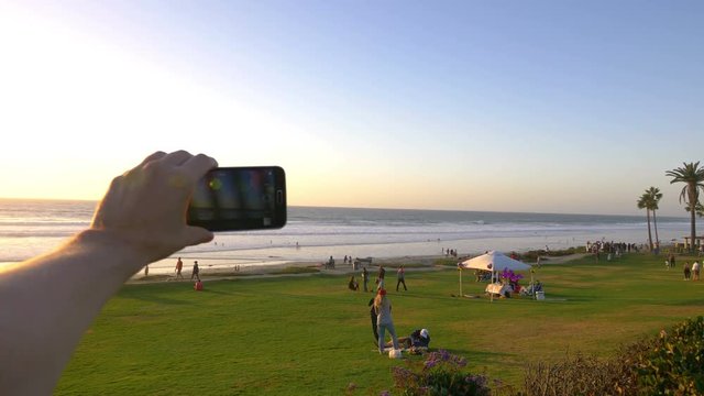 Point of view on the taking selfie photo on beach in Del Mar California in 4K slow motion 60fps 